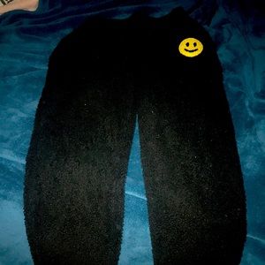 Black fuzzy pajama pants with smoky face